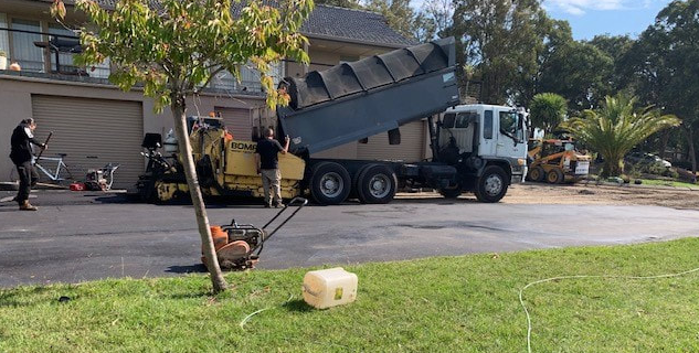 This is a photo of an asphalt driveway which is in the process of being installed by Singleton Road Tek